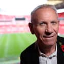 Former England player Peter Reid poses for a picture during a photocall for the match ball used in the 1986 FIFA World Cup Quarter-Final football match between Argentina and England, ahead of its auction, at Wembley Stadium in London on November 1, 2022.