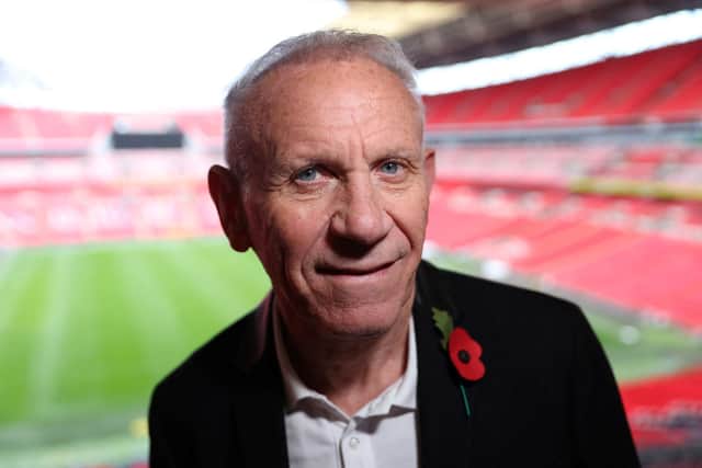 Former England player Peter Reid poses for a picture during a photocall for the match ball used in the 1986 FIFA World Cup Quarter-Final football match between Argentina and England, ahead of its auction, at Wembley Stadium in London on November 1, 2022.