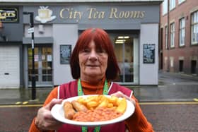 City Tea Rooms are offering free meals for children during half term. Staff member Margaret Corbett outside the cafe.