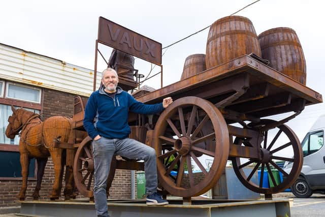 Artist Ray Lonsdale with his metal sculpture 'Gan Canny'.
