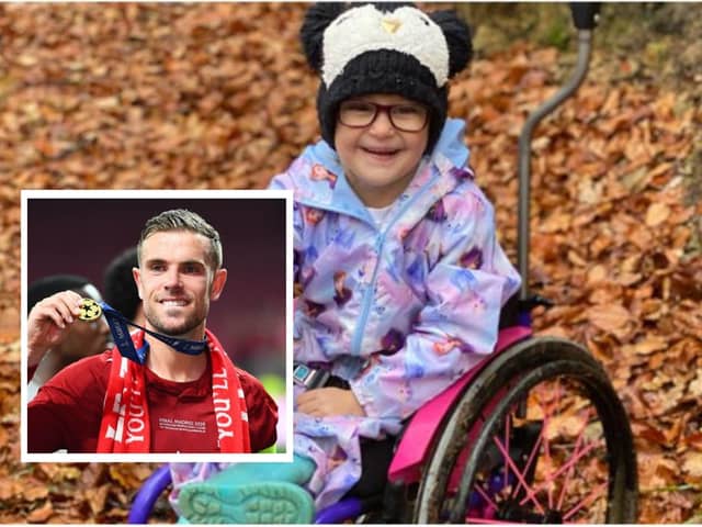 Jordan Henderson donated boots which were auctioned off to pay for Rubie's wheelchair