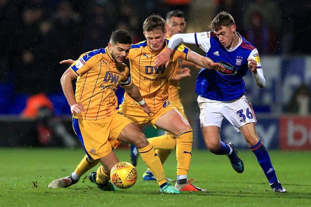 IPSWICH, ENGLAND - DECEMBER 15: Jack Lankester of Ipswich Town competes for the ball with Callum Connolly and Sam Morsy of Wigan Athletic during the Sky Bet Championship match between Ipswich Town and Wigan Athletic at Portman Road on December 15, 2018 in Ipswich, England. (Photo by Stephen Pond/Getty Images)