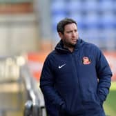 Lee Johnson watches on at the DW Stadium