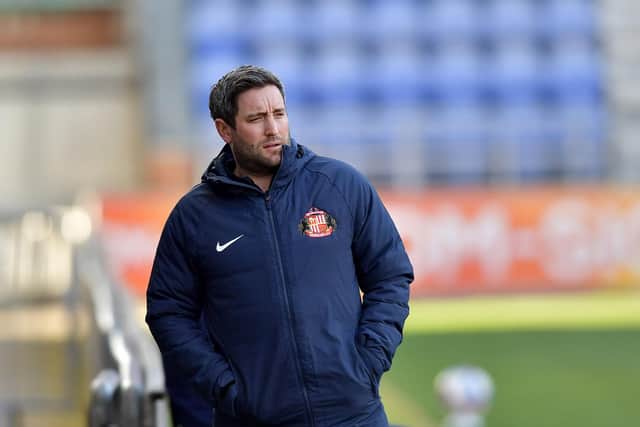 Lee Johnson watches on at the DW Stadium