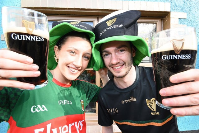 University students Isabella Tierney from County Mayo and Ciaran Roche from Dublin raise a glass.