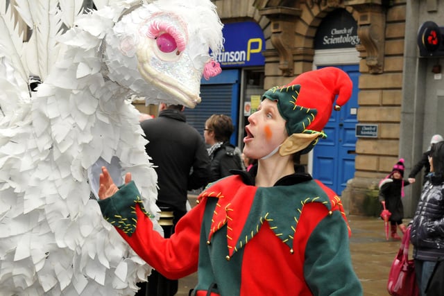 An elf meets a new friend on Santa's parade in Sunderland in 2011.