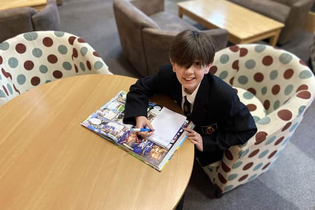 Year 8 pupil Otis Arkley in the library at Southmoor Academy. 

Picture by FRANK REID.