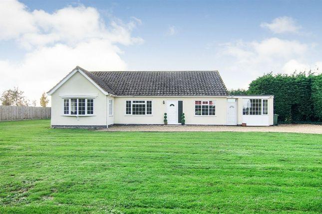 Located in the Milking Nook area of Peterborough, this property features a gated entrance which leads to a gravel driveway with off-road parking.
