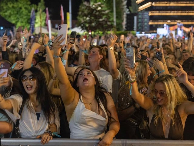 Fans capture the moment.