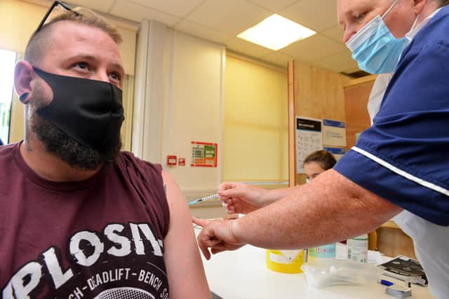 Luke Kennedy receives his vaccine at the Technology Park One during drop in clinic for students and over 18s.