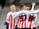 Sunderland celebrate their opening goal against Manchester United U21s on Wednesday evening