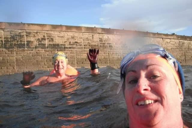 Georgina Fuller and Sam Mason are outdoor swimming every day during December to raise funds for the Waddington Street Centre.