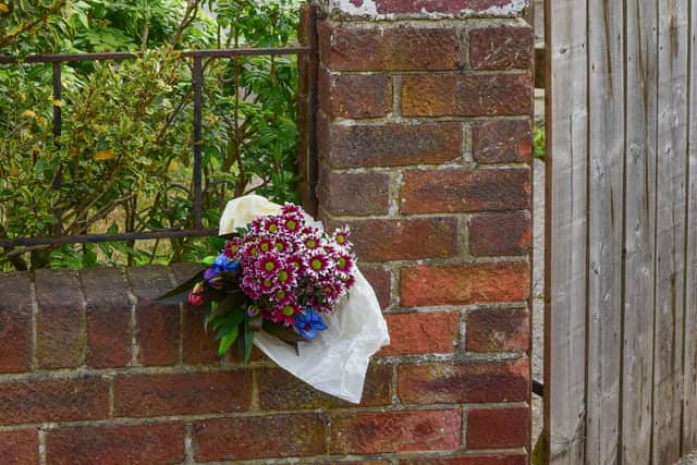 Flowers left outside a house in Park Avenue, Silksworth this morning