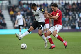 DERBY, ENGLAND - APRIL 23: Ravel Morrison (L) of Derby County in action with Matty James of Bristol City during the Sky Bet Championship match between Derby County and Bristol City at Pride Park Stadium on April 23, 2022 in Derby, England. (Photo by Nigel Roddis/Getty Images)