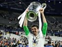 Thibaut Courtois celebrates with the trophy after the UEFA Champions League final football match between Liverpool and Real Madrid at the Stade de France in Saint-Denis, north of Paris, on May 28, 2022. - Real Madrid won the match 0-1. (Photo by JAVIER SORIANO / AFP) (Photo by JAVIER SORIANO/AFP via Getty Images)