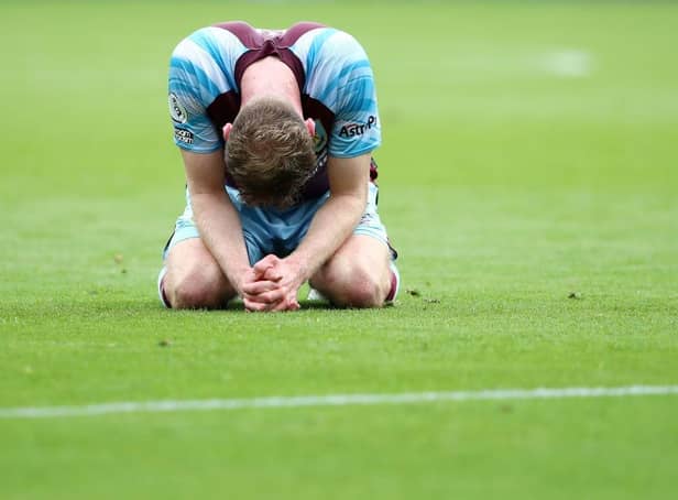 Nathan Collins of Burnley looks dejected following defeat and relegation to the Sky Bet Championship following the Premier League match between Burnley and Newcastle United at Turf Moor on May 22, 2022 in Burnley, England. (Photo by Jan Kruger/Getty Images)