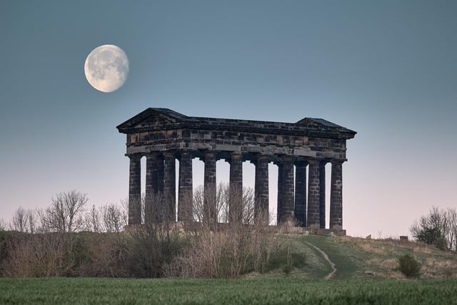 The moon rises over Penshaw Monument in this peaceful picture.