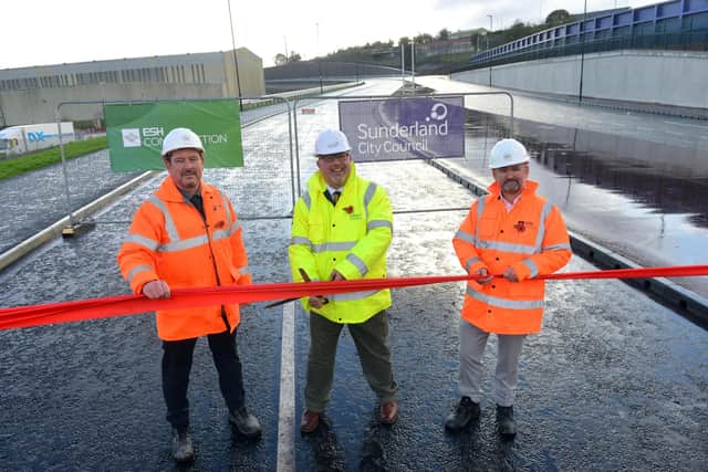 Sunderland City Council leader Coun Graeme Miller officially opens the third phase of Sunderland Stategic Transport Corridor with Esh Construction Project Director Steve Garrigan and Esh Construction CE Andy Radcliffe (R).