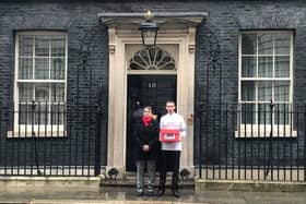 Christopher Head and Kate Osborne MP hand over the petition at 10 Downing Street.