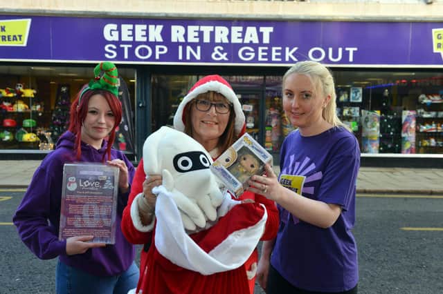 Geek Retreat Christmas toy appeal. From left Gemma Wilkinson, Gillian Pickes from Love Amelia charity and Laura Green.