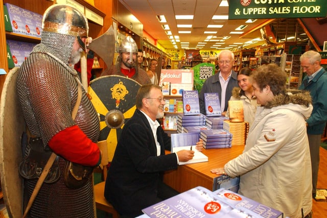Author Bernard Cornwell was flanked by 'Vikings' when he signed copies of his book in 2005.