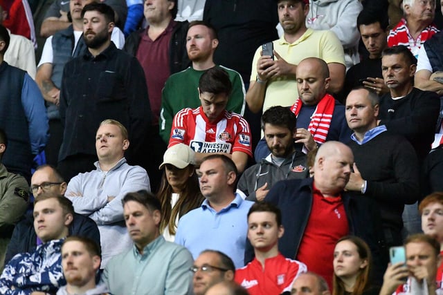 Sunderland players and fans observe silence.