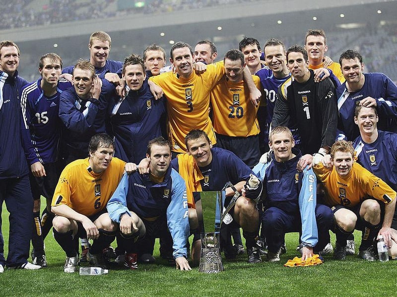 Scotland players celebrate with the Kirin Cup trophy after holding Japan to a 0-0 draw in the Kirin Cup Soccer 2006 tournament at the Saitama stadium on May 13, 2006 in Saitama, Japan. (Photo by Koichi Kamoshida/Getty Images)