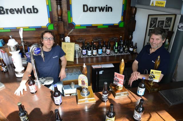 Julio Romero Johnson, left, and Keith Thomas, from Darwin Brewery, with some of the bottled beers they are now selling direct from the premises.