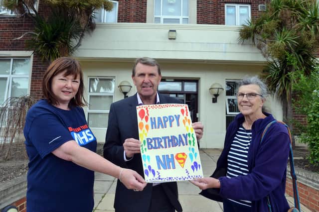South Tyneside and Sunderland NHS Foundation Trust CEO Ken Bremner receives an NHS 74th birthday card from Keep Our NHS Public secretary Laura Murrell and former Sunderland GP Pam Wortley.