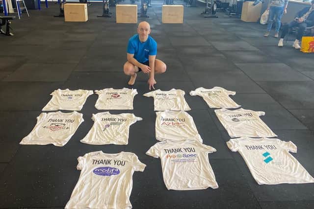 Gav Cogdon with t-shirts of support