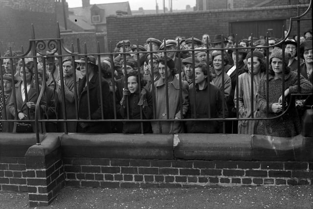 Parents and friends watch as children are evacuated from Chester Road schools in 1939.