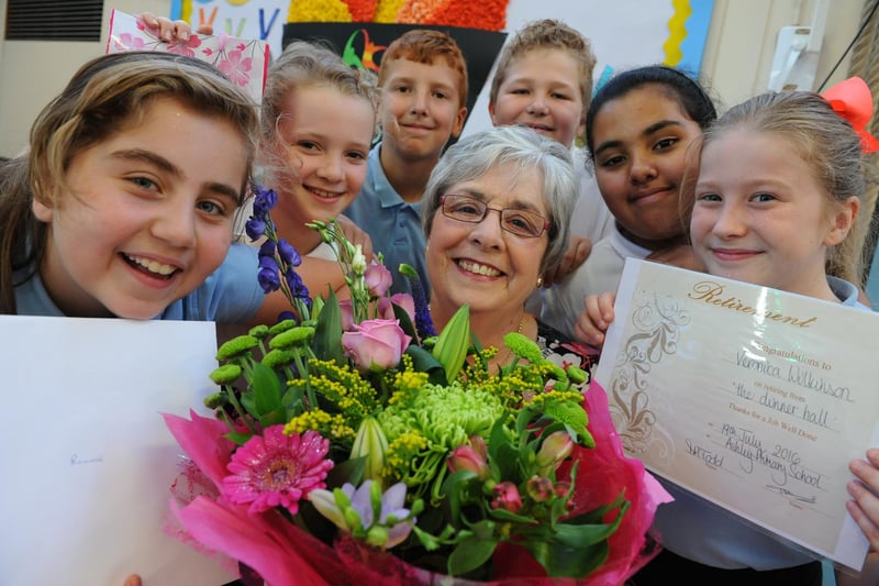 Dinner nanny Roni Wilkinson receives flowers and presents from Ashley Primary School pupils, to mark her retirement in 2016.