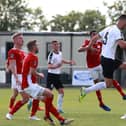 Jake Cooper of Gateshead scores the first goal during the Vanarama National League North Play-Off match between Brackley Town and Gateshead.