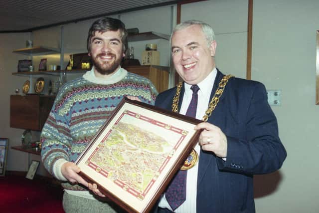 Mike Clay who walked 120 miles to create a painting of Sunderland. Here he is presenting his picture to the Mayor Sunderland, Councillor Bryan Charlton.