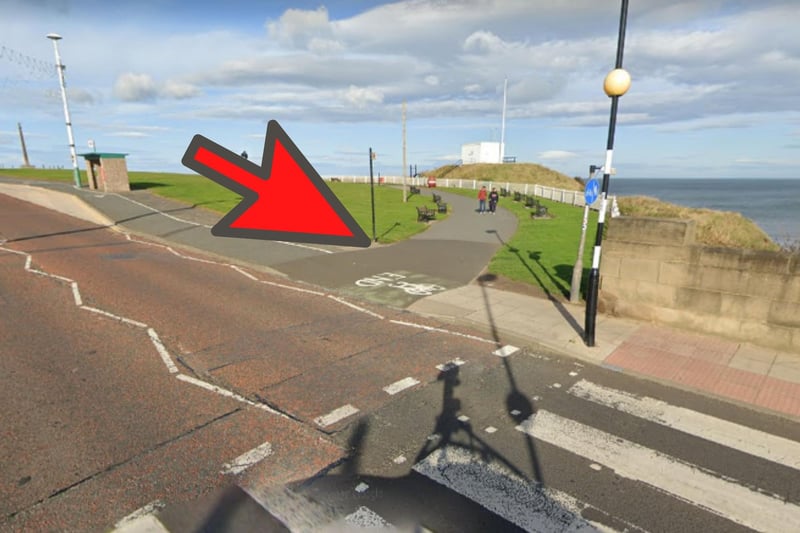 Once you reach the crossing adjacent to Roker Park, turn right onto the footpath and continue along the coast, passing the red naval mine on the right and Bede’s Cross on the left.