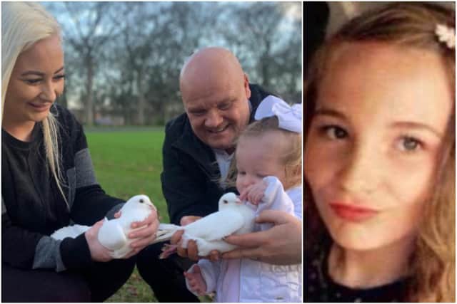 Jess King and her daughter Josie Rae get ready to release doves in memory of Josie on what would have been her 18th birthday with the help of Tony Clarke, who provided the birds for the occasion.