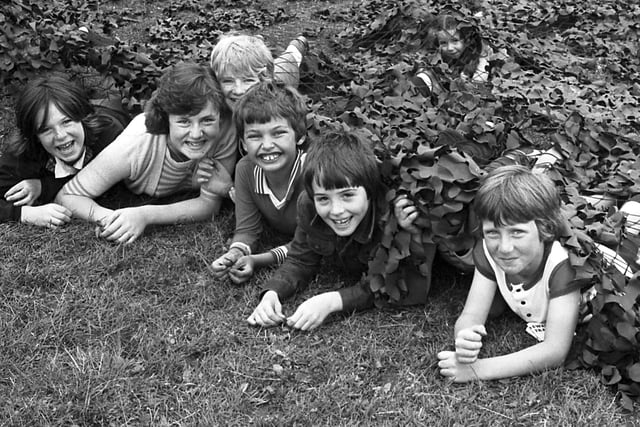These children were enjoying themselves under camouflage at the finals of the Police Playscheme in 1979.