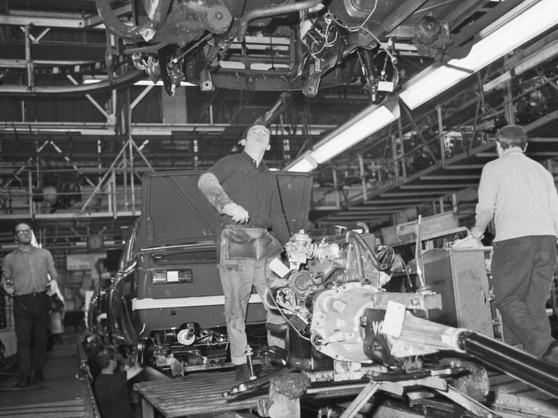 Man working with an engine on the assembly line at the Rootes car plant at Linwood in December 1971.