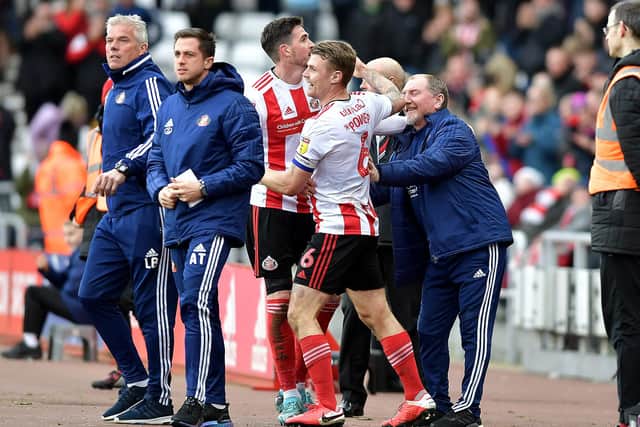 Kyle Lafferty celebrates a goal last season with John Cooke (right).