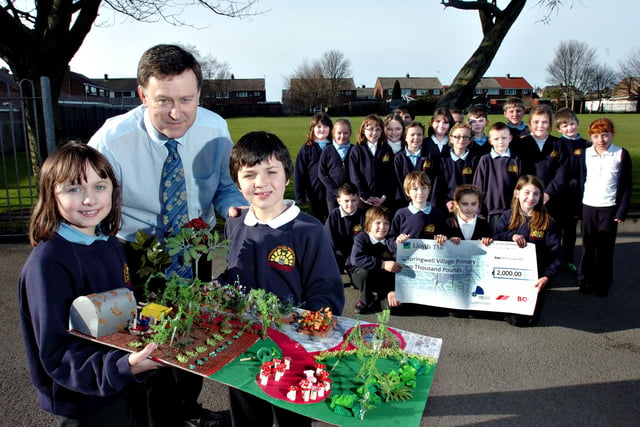 Alex Heywood and Joe Christian, right,  were showing the plans for a new garden at Springwell Village Primary School in 2011. They were joined by fellow Class 4 pupils.