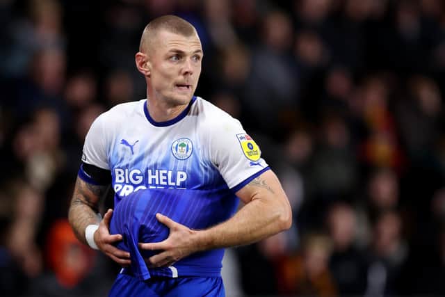 HULL, ENGLAND - OCTOBER 05: Max Power of Wigan Athletic prepares to take a throw in during the Sky Bet Championship between Hull City and Wigan Athletic at MKM Stadium on October 05, 2022 in Hull, England. (Photo by George Wood/Getty Images)