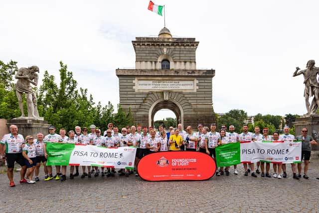 Foundation of Light cyclists at their finishing point in 2022 at the Ponte Milvio Bridge in Rome. Picture by Michael Oliver.