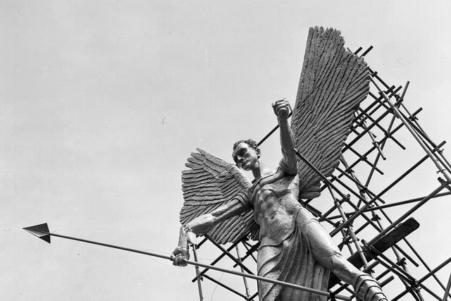 The Jacob Epstein statue of St Michael and the Devil above Waverley Market, promoting the Epstein Exhibition during the Edinburgh Festival in 1961.