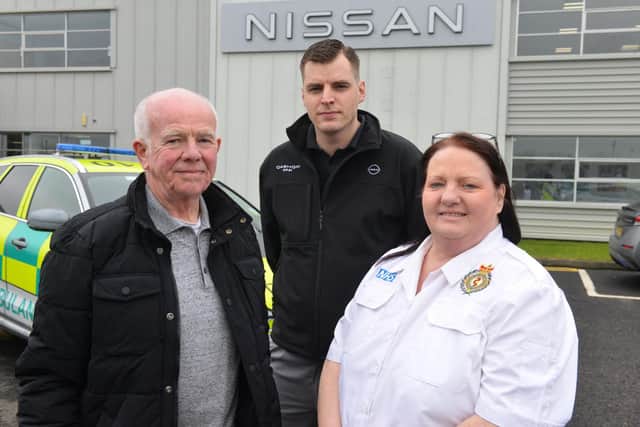 Frank Kelly and David Freeman with North East Ambulance Service call handler Lisa Studholme