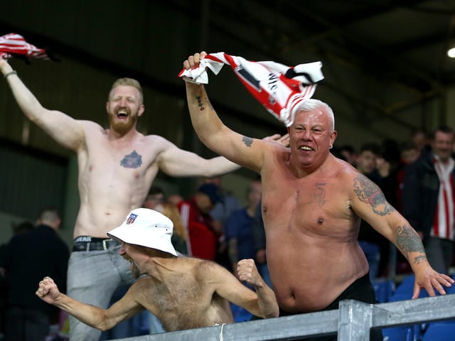 Sunderland fans celebrate during the Carabao Cup second-round match between Burnley and Sunderland at Turf Moor on August 28, 2019.