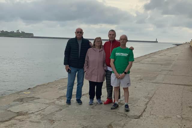 Paul Harvey, dressed in his green Macmillian fundraiser T-shirt with friend Alan Procter, and Mary Storey's children Alan and Susan Gauci as he prepared to set off from South Shields for Roker.