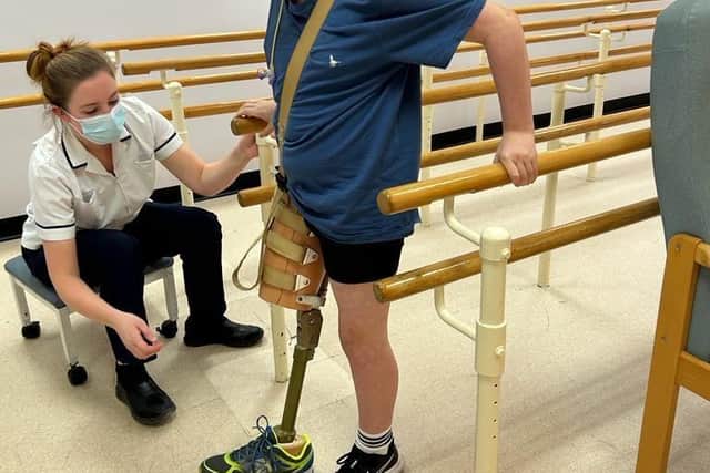 Theo is learning to walk with a prosthetic