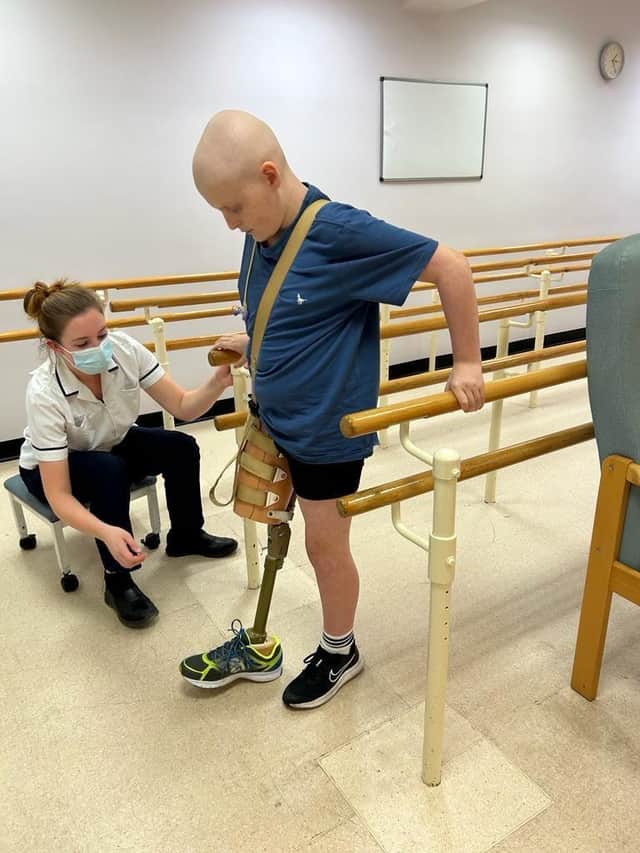 Theo is learning to walk with a prosthetic