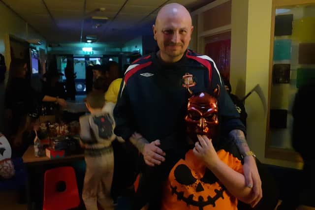 Alfie Meliville, 9, dressed as a devil alongside dad Chris Melveille, 42.