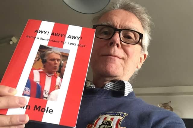 Ian Mole with a copy of his new book.